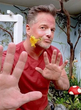 Artist, Designer Aaron Christensen from Embellishments Studio romances the outdoor rooftop garden he's building.